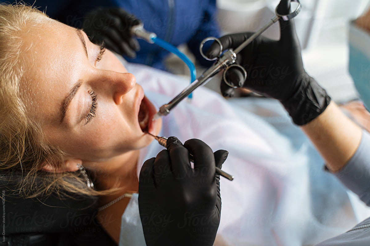 Dental specialists giving anesthesia to patient