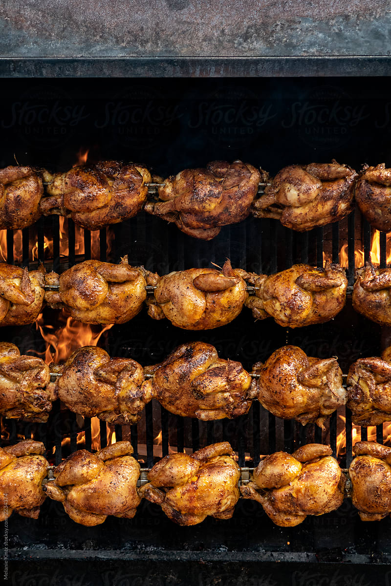 Street food: Chicken being grilled on large grill