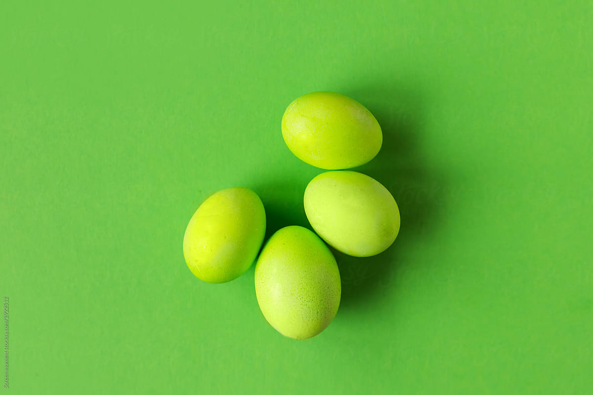 Green Easter eggs on green background. Copyspace. Still life photo of lots  eggs. .  Easter photo concept