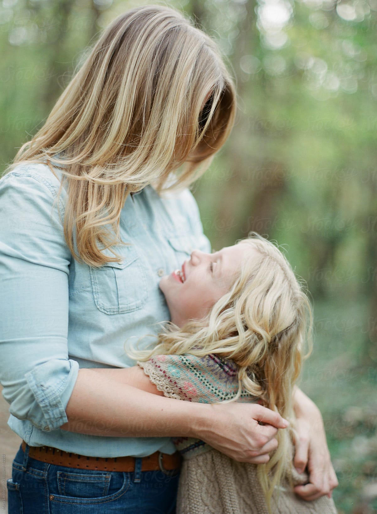 Daughter And Mother Hugging And Smiling By Stocksy Contributor Marta