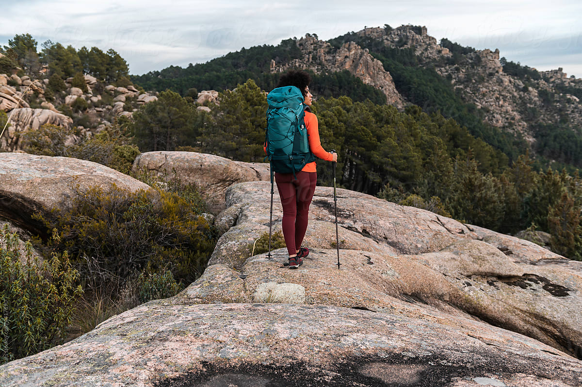 Diverse female hiking and backpacking alone , outdoor lifestyle