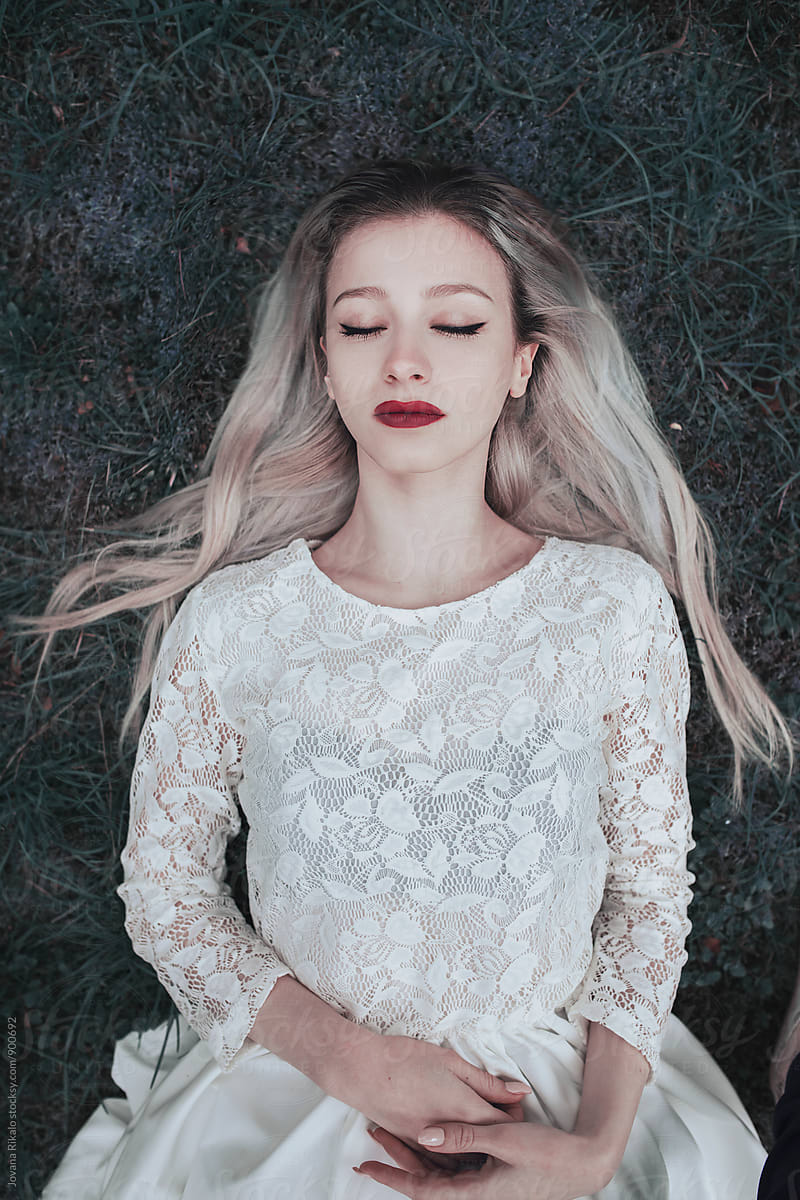 Dreamy Portrait Of A Young Woman Lying On Grass By Stocksy Contributor Jovana Rikalo Stocksy