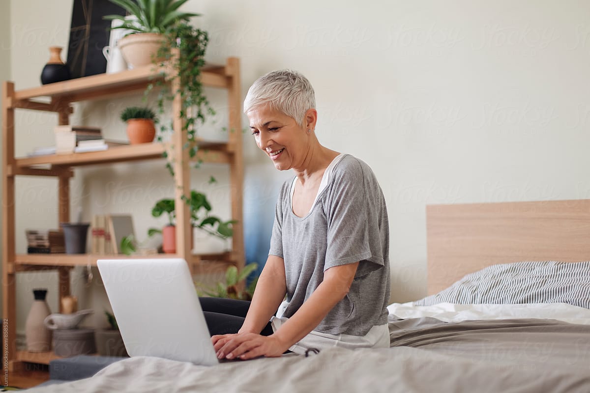 Woman Using A Laptop At Home By Lumina Woman using a laptop at home by lumina