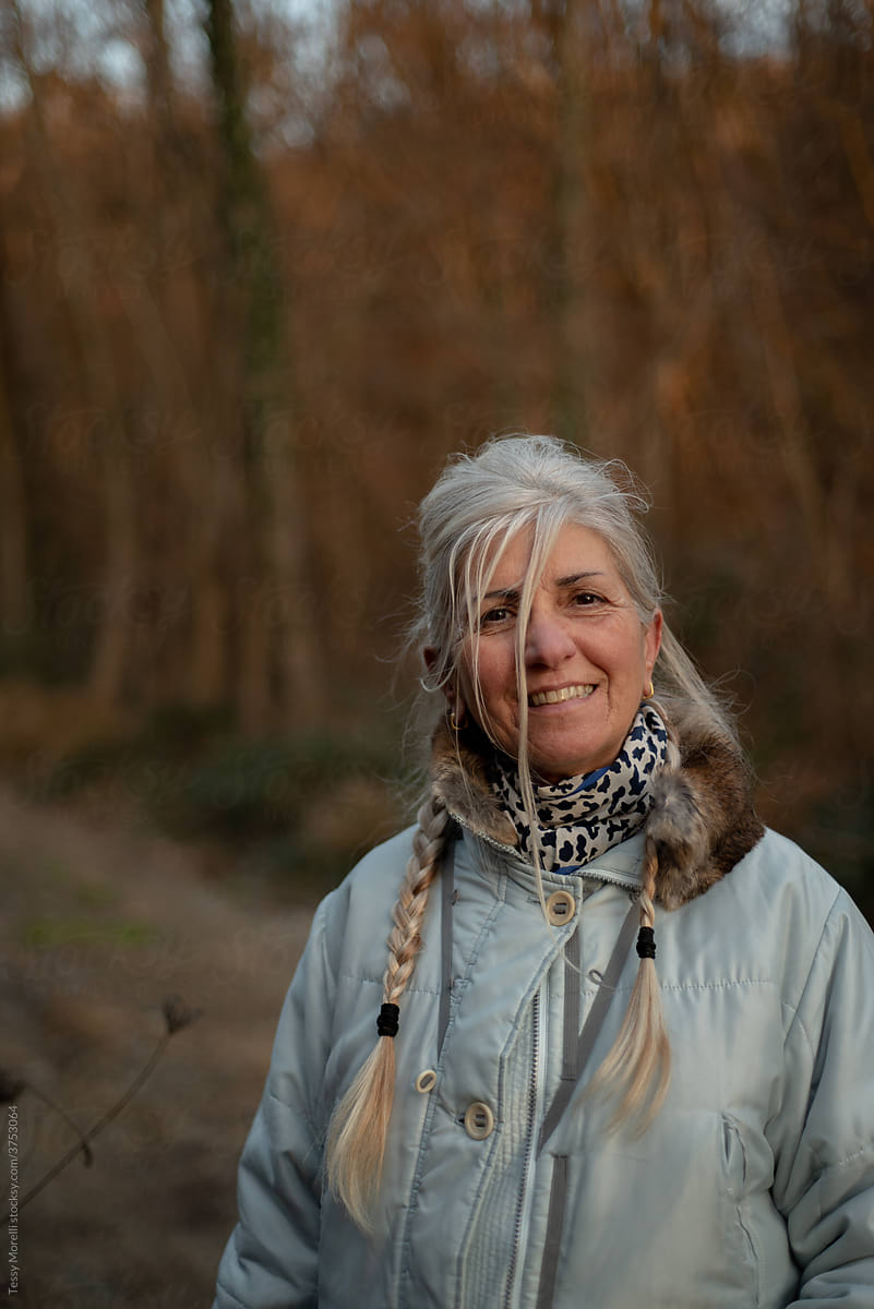 Portrait of smiling Senior woman on a winter hike