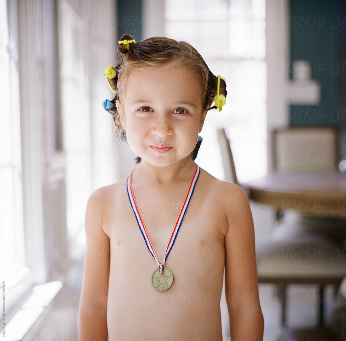 Cute Young Girl With A Medal Around Her Neck By Jakob Lagerstedt 