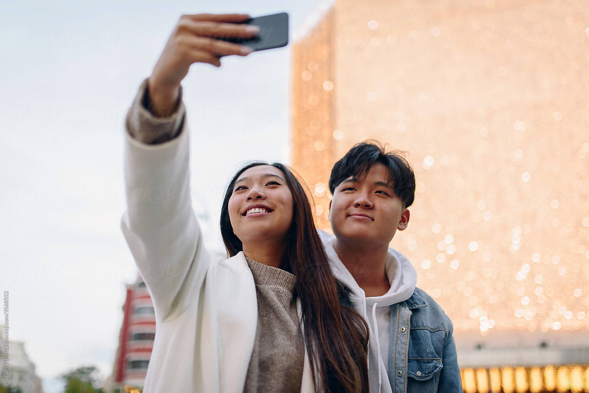 Chinese young couple taking a selfie