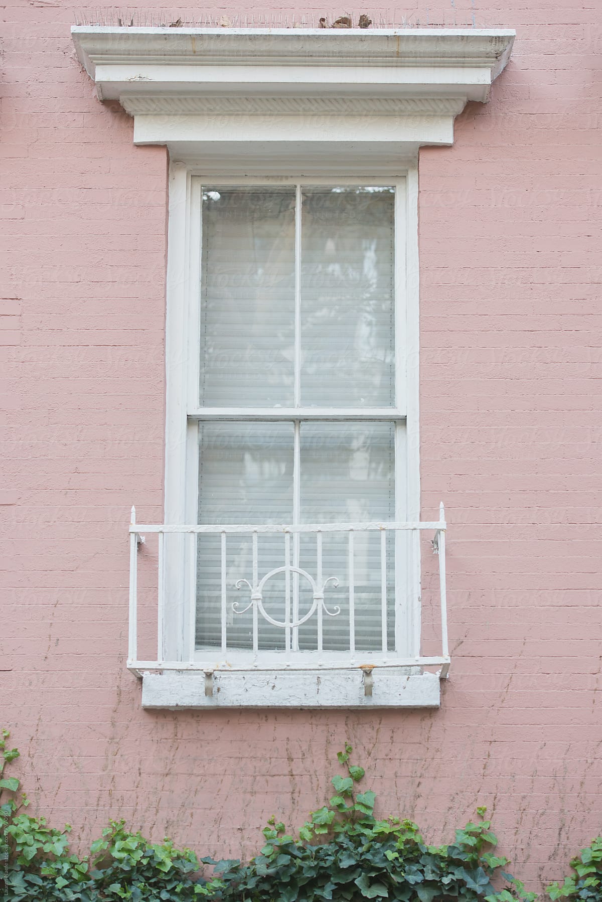 White window on pink building