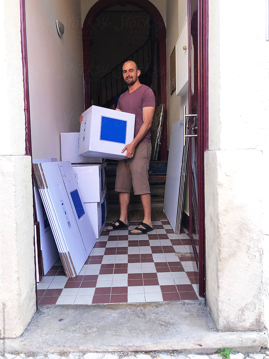 UGC portrait of man house move boxes