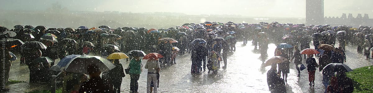 Rain,crowd,umbrellas and sun