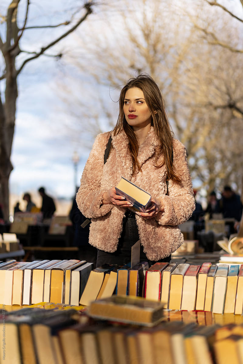 A woman in an outdoor book store