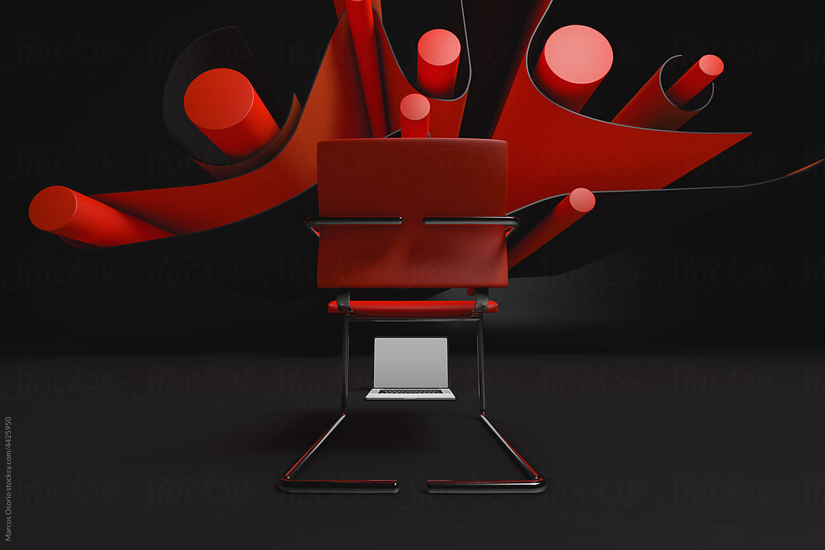 Laptop and chair next to an abstract background