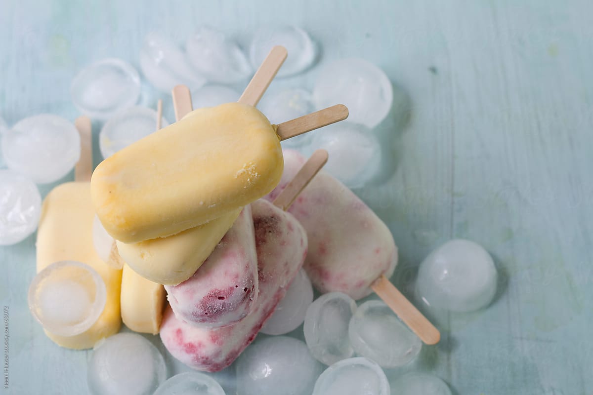 Stack of two different kind of popsicles on ice