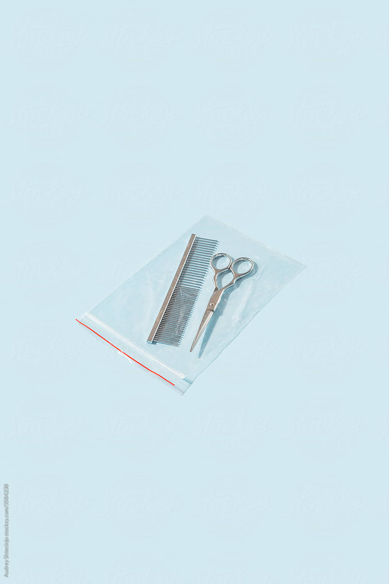 Scissors and comb packed In plastic bag