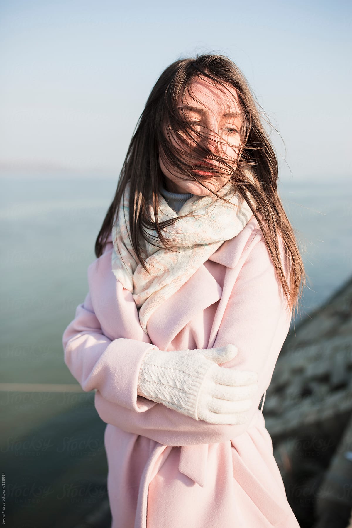 Portrait of a beautiful young woman wearing pink coat