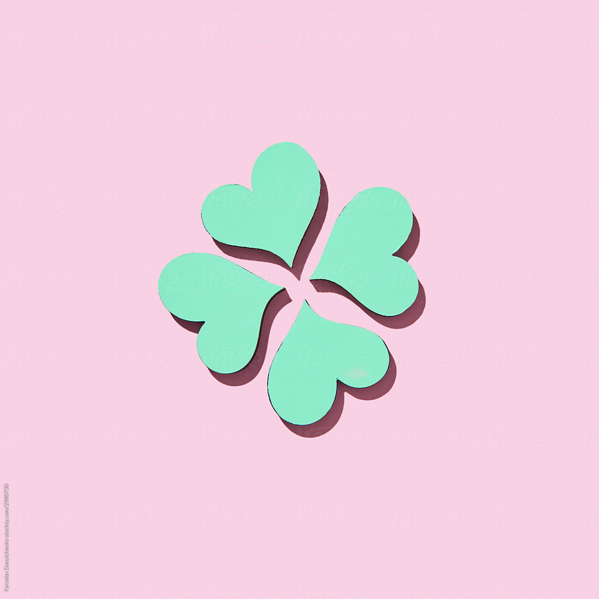 Handmade paper green shamrock\'s four petals.