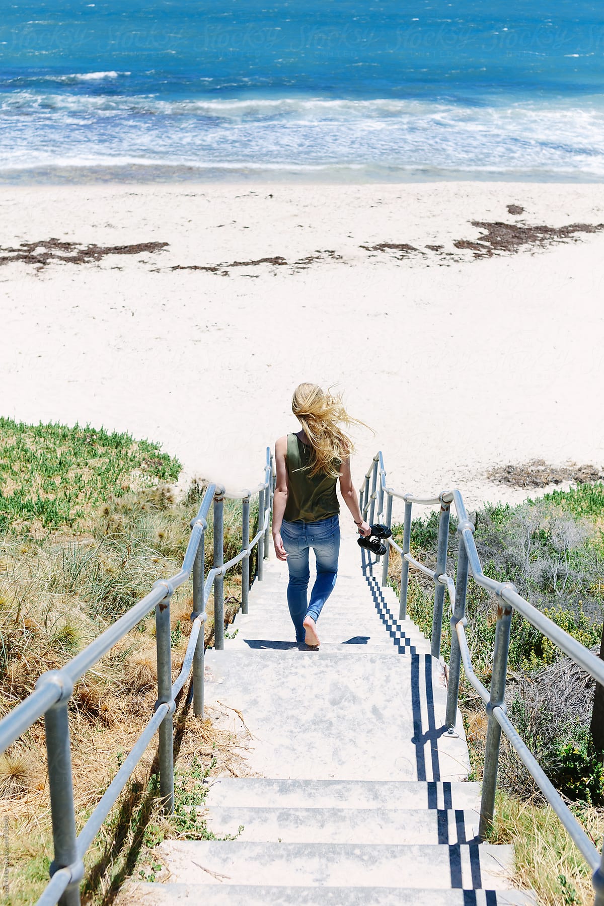 Teenage Girl Walking Down A Flight Of Stairs To The Beach Del Colaborador De Stocksy Jacqui 5077