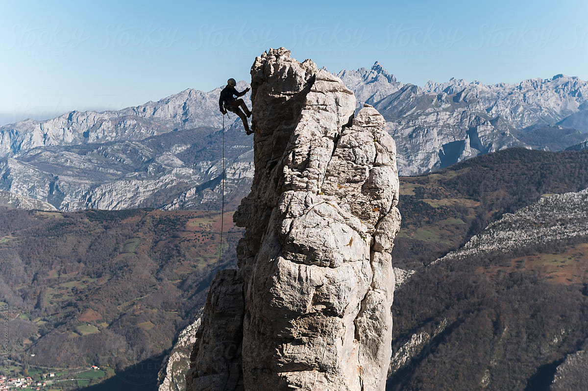 Climber climbing pinnacle
