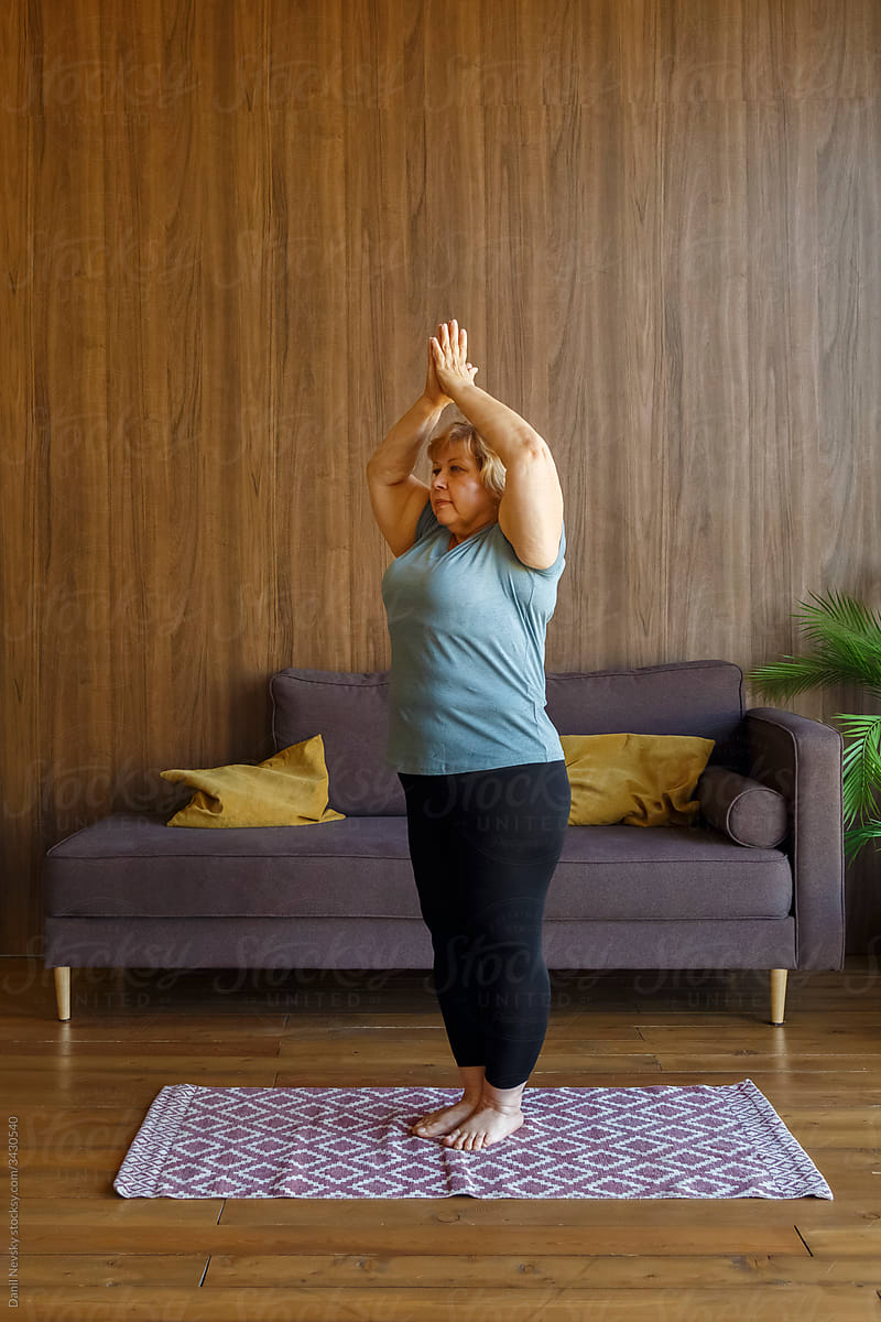Premium Photo | Rear view of slim woman doing yoga exercise meditating  sitting in lotus pose with arms raised up