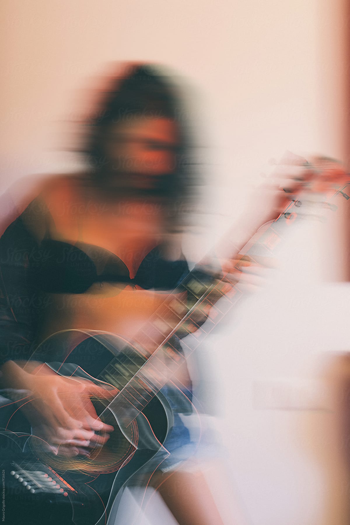Woman Playing Guitar By Stocksy Contributor Mauro Grigollo Stocksy