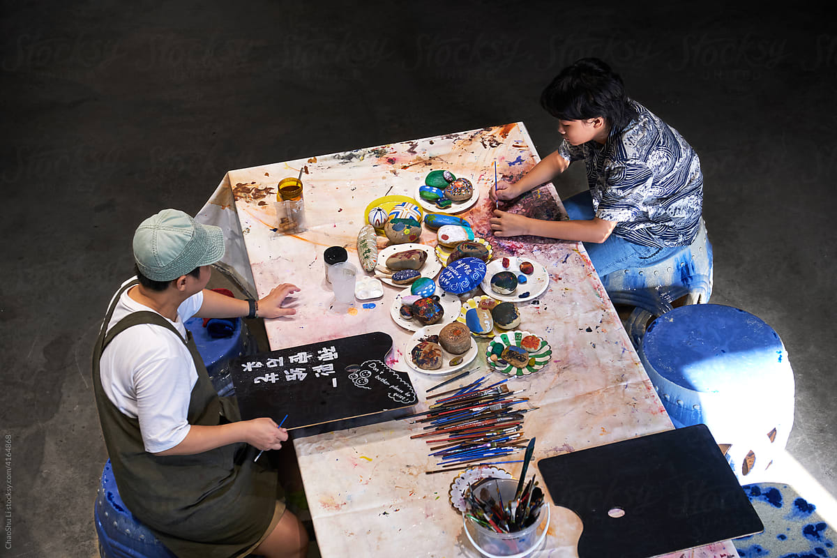 Asian girl painting in the studio