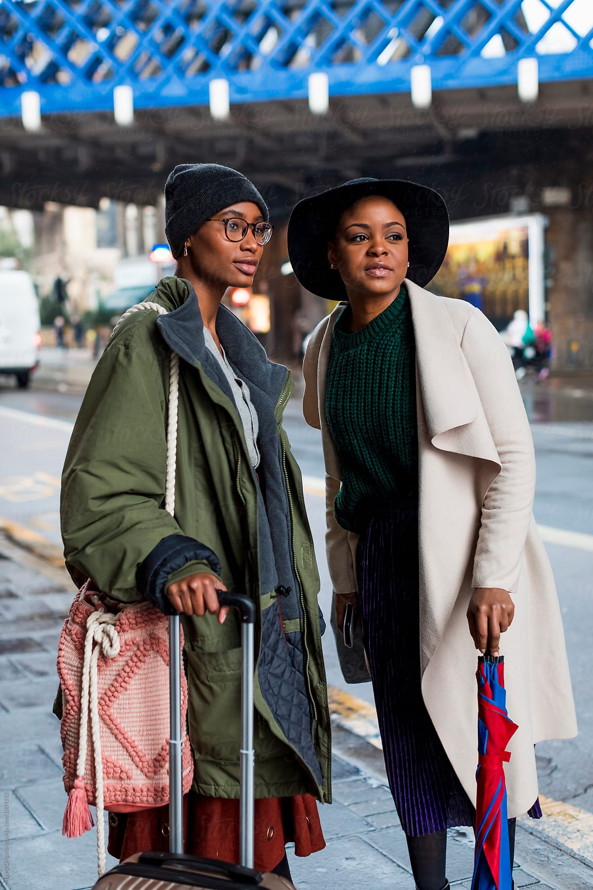 Fashionable Black women waiting for the bus