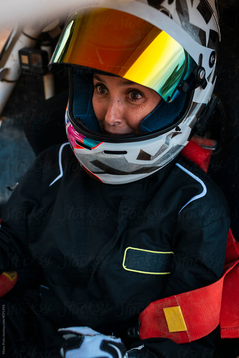 Excited woman driving a go-kart