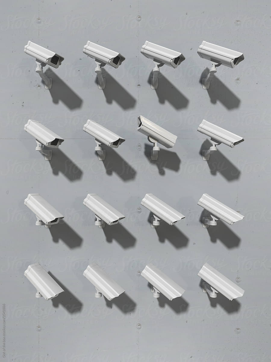 Group of cctv cameras pointing at the same direction except one