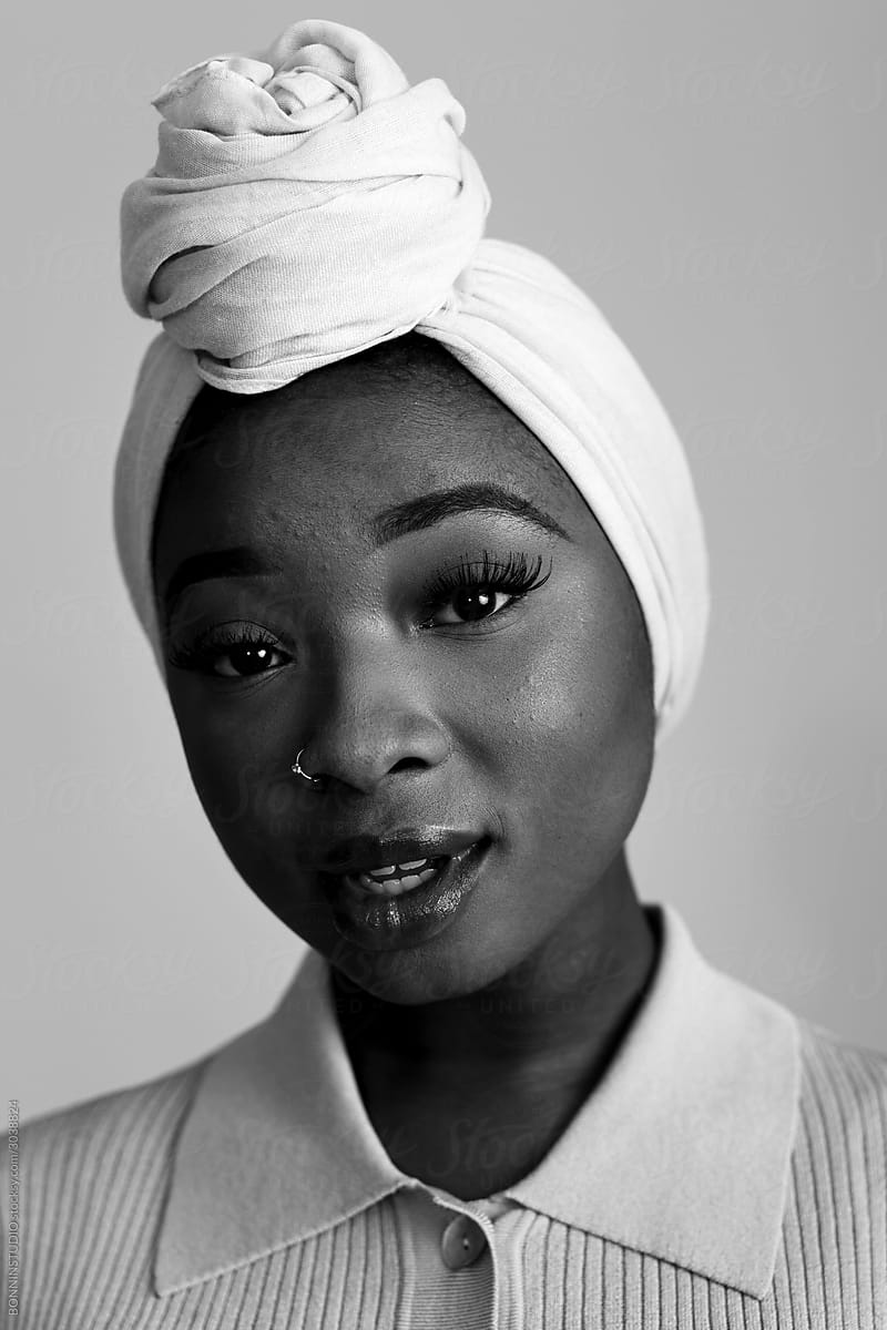 Young black female in traditional headscarf