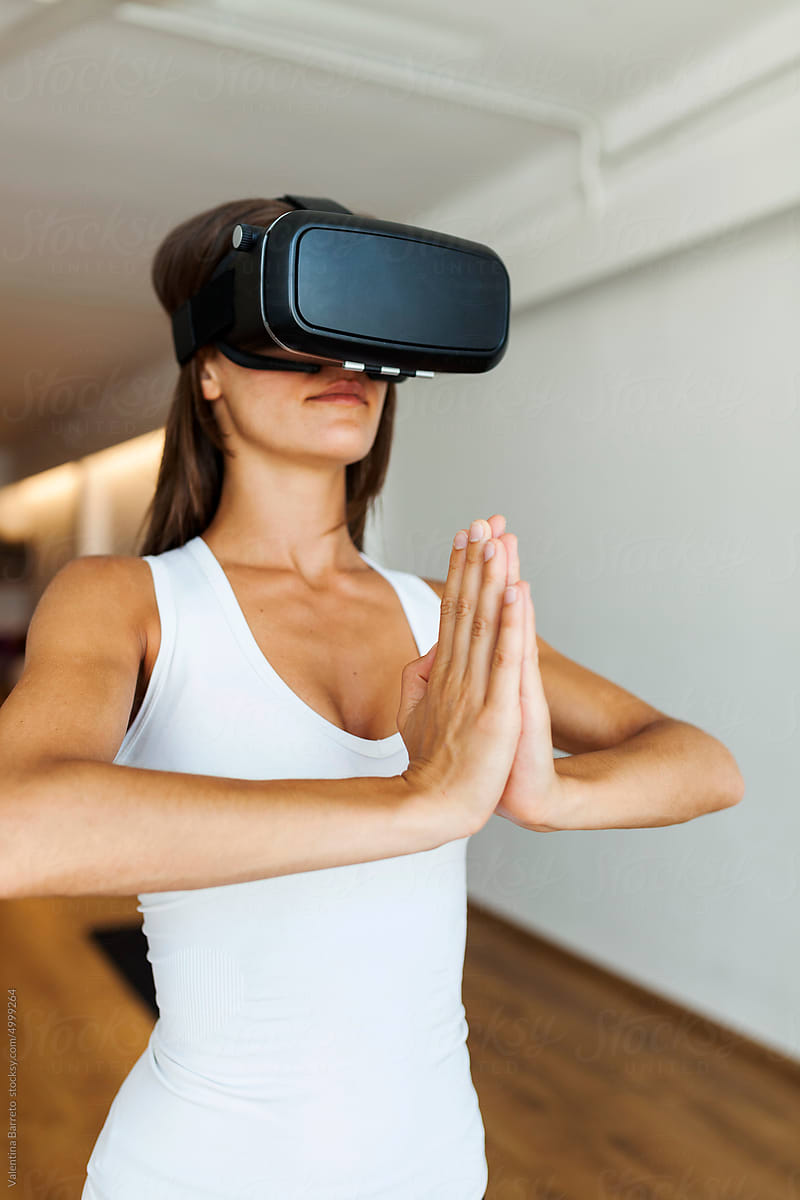 Woman practicing virtual yoga