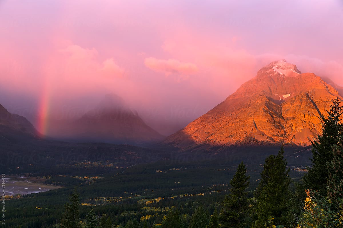 Rainbow at Sunrise in the Mountains at Glacier National Park
