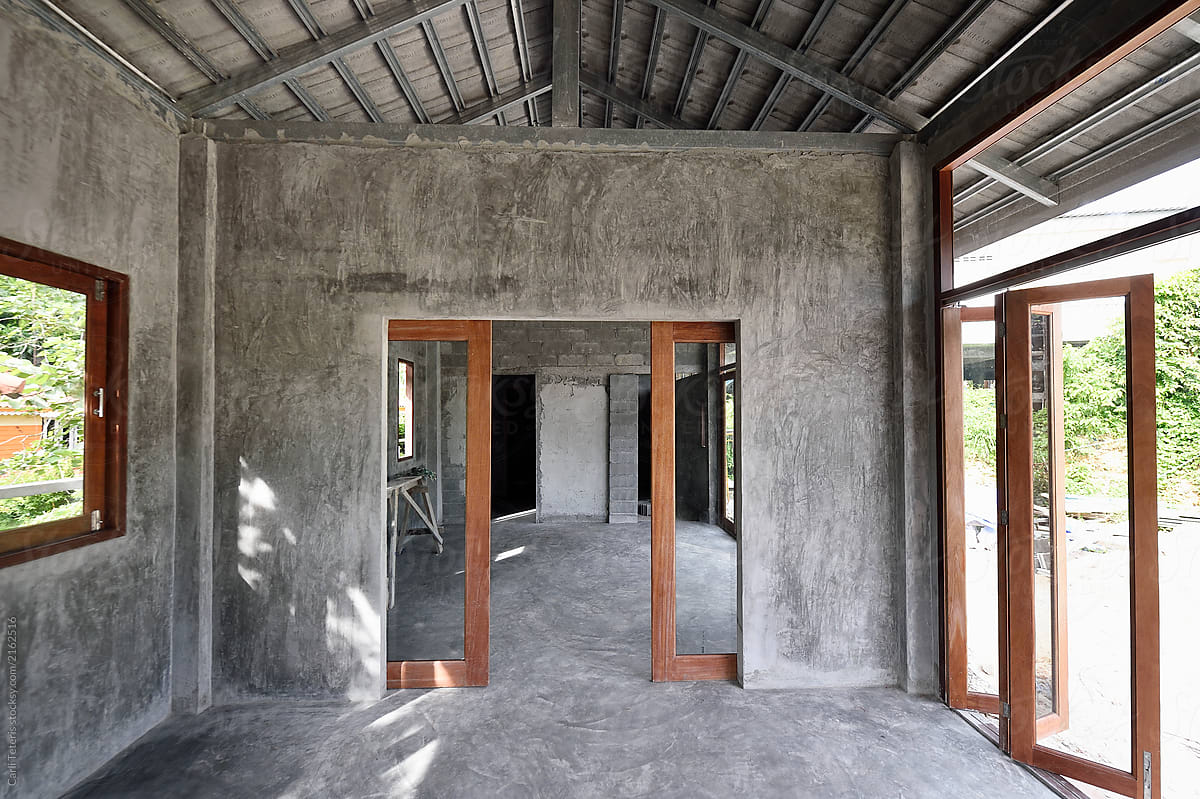 Empty Interior Of An Unfinished Concrete And Wood Home Under