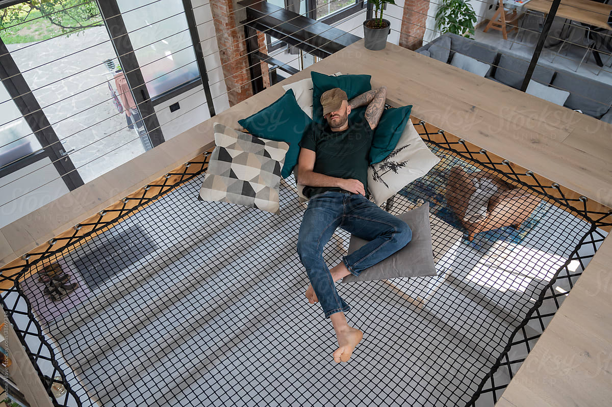 Man relaxing on a loft net