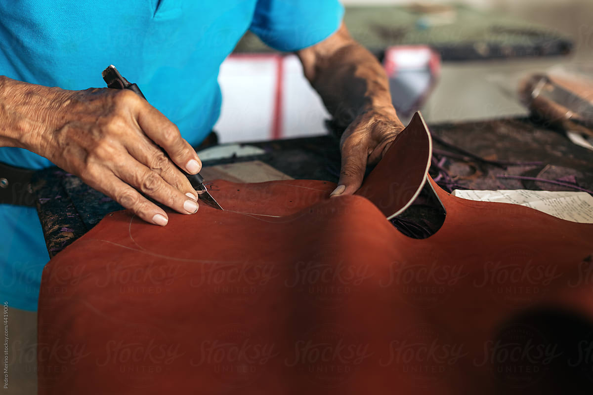 Close up of a shoemaker working on a sole