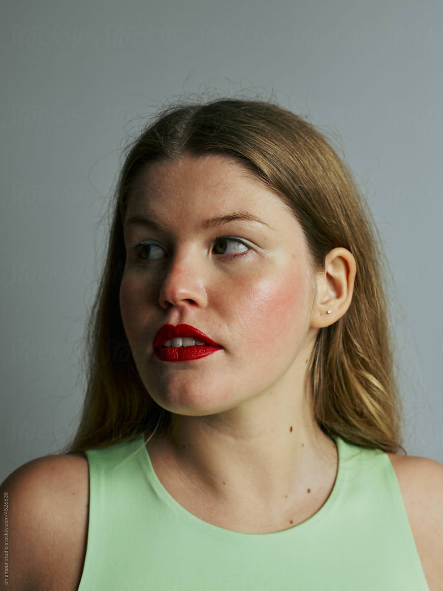 contrasting light on her face - beauty brand - portrait with red lips