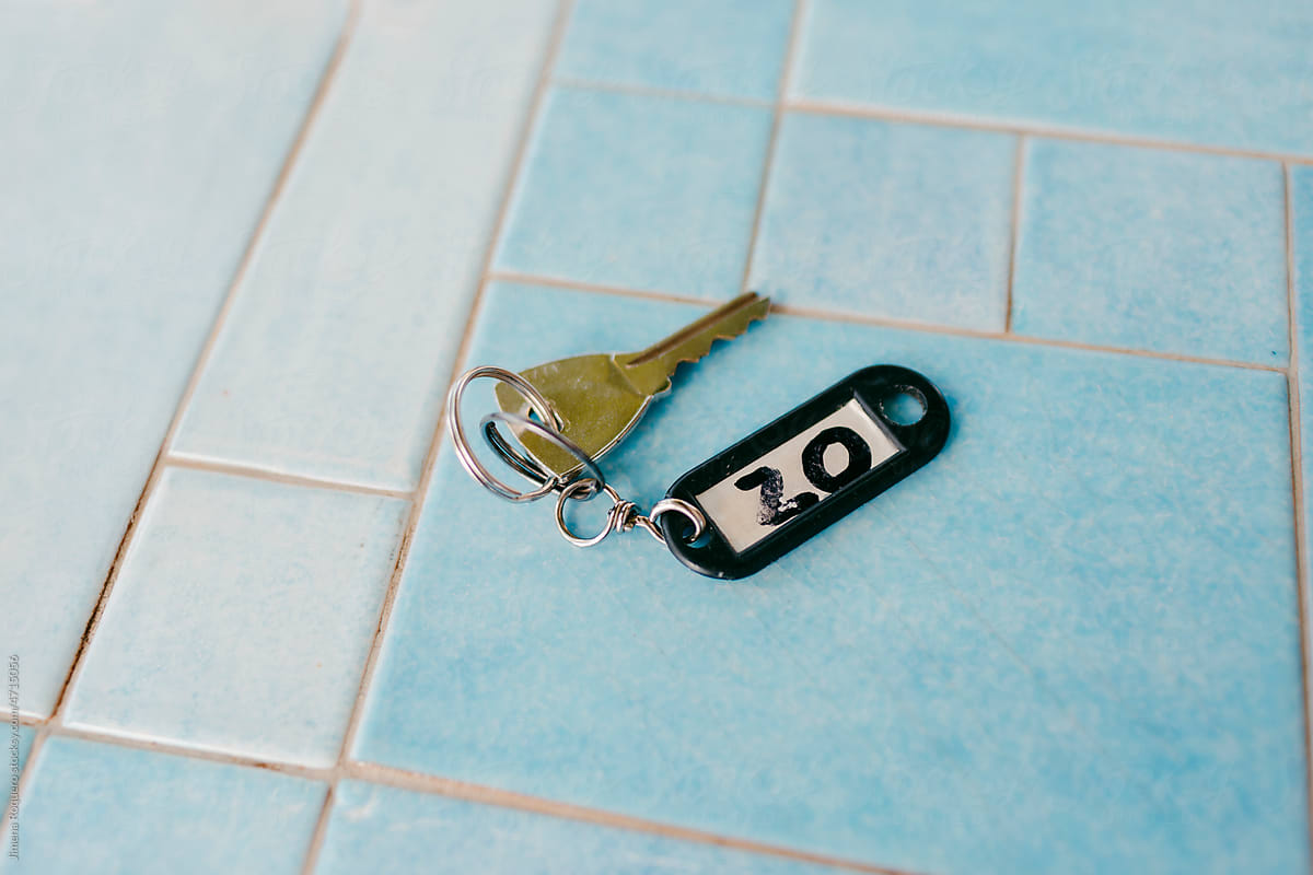 Hotel room keys on tile table
