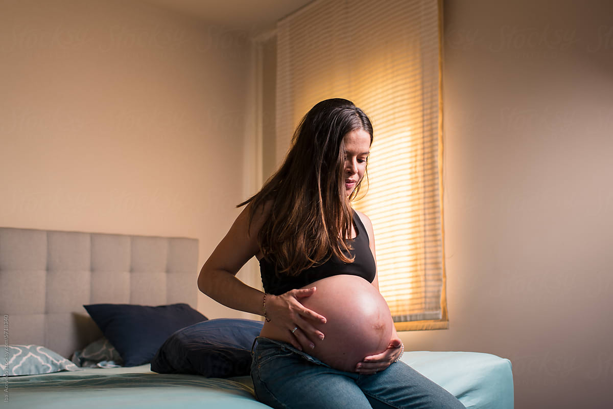 Pregnant woman feeling baby movement