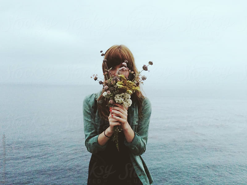 Download Woman Holding Flowers in Front of Face by Kevin Russ ...