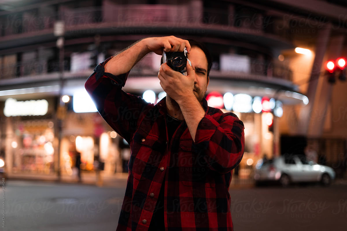 Photographer Taking Film Photos On The City