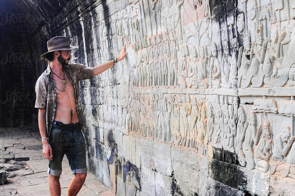Traveller Man Explore Ancient Wall In Cambodia