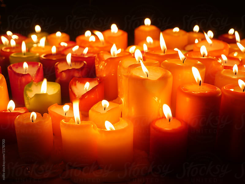 Close up of red burning candles.