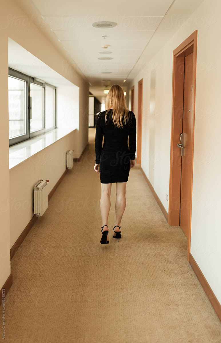 woman walking away in dress