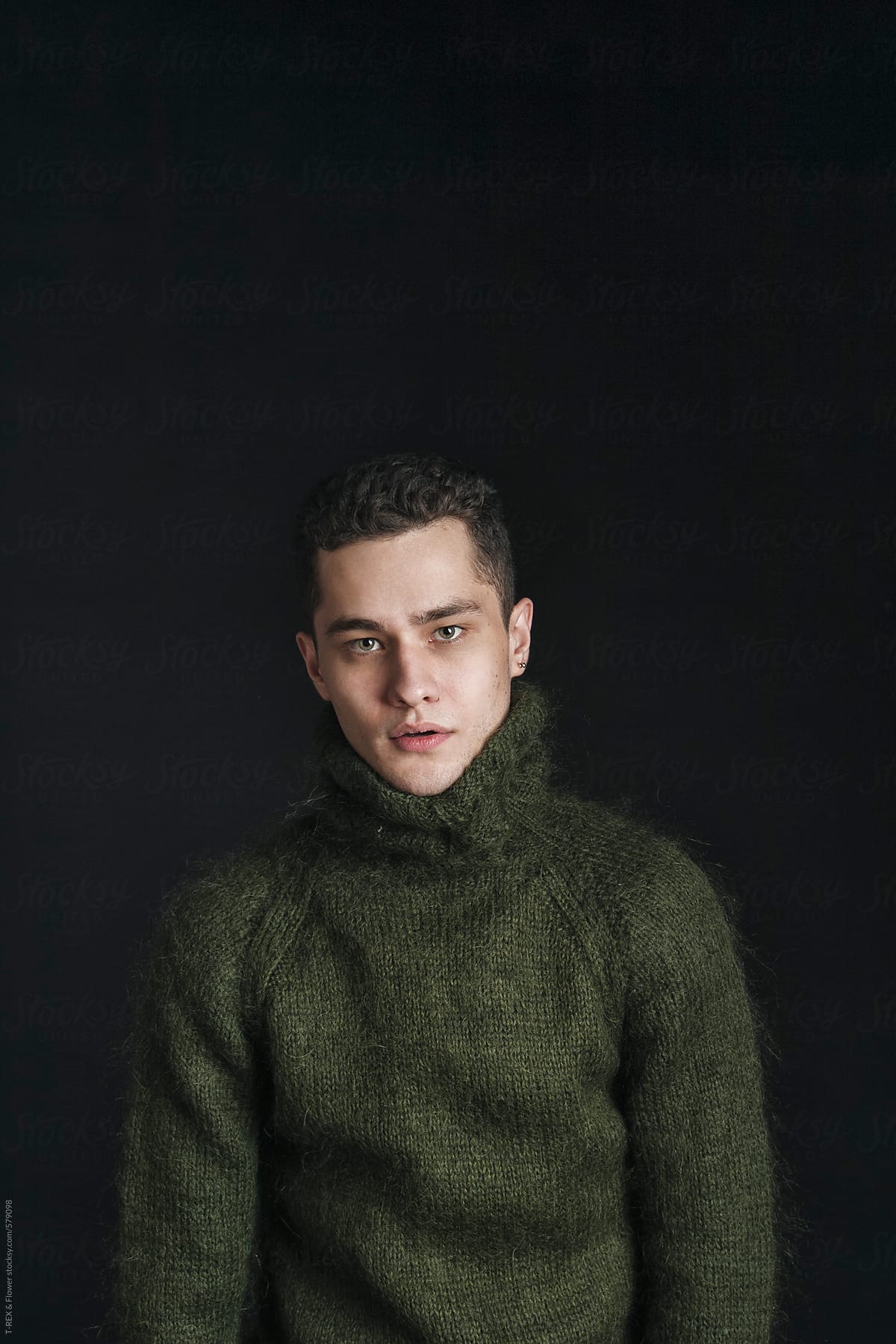 Trendy handsome stylish man in warm woolen pullover