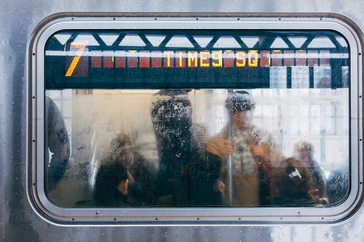 New York City commuters in subway car.