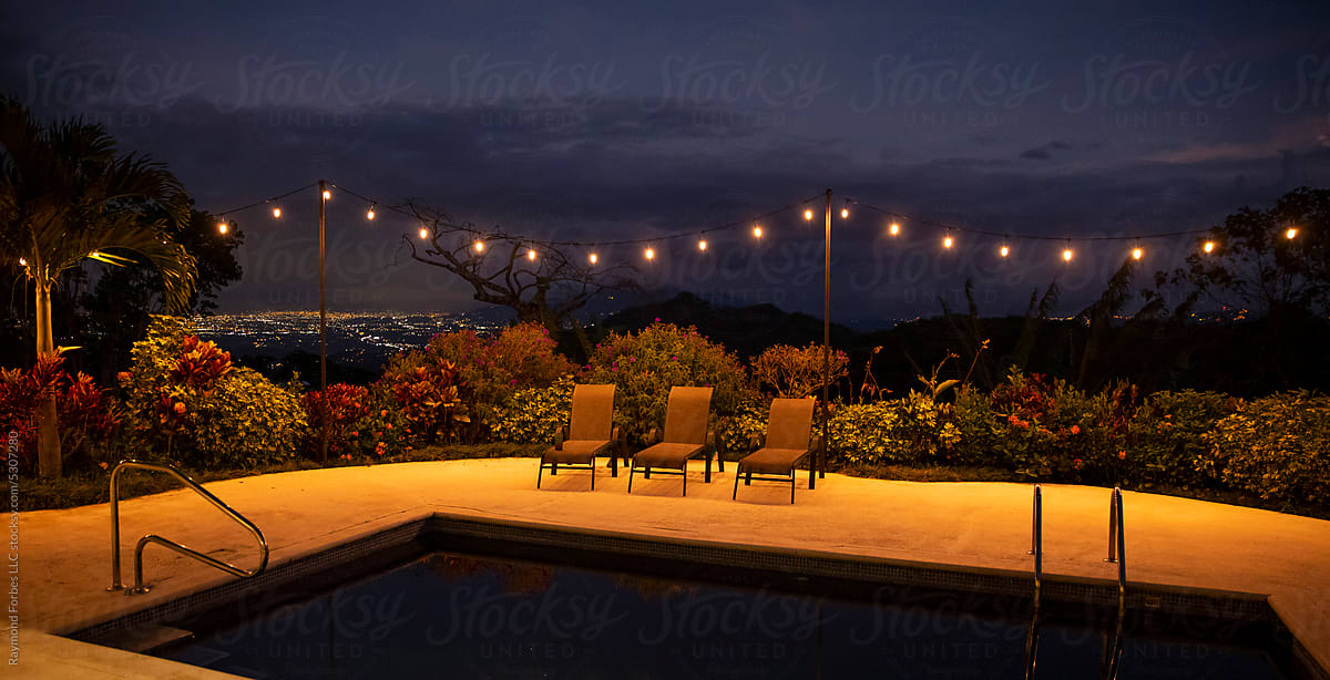 String Lights Around Swimming Pool Sunset Landscape In Costa Rica