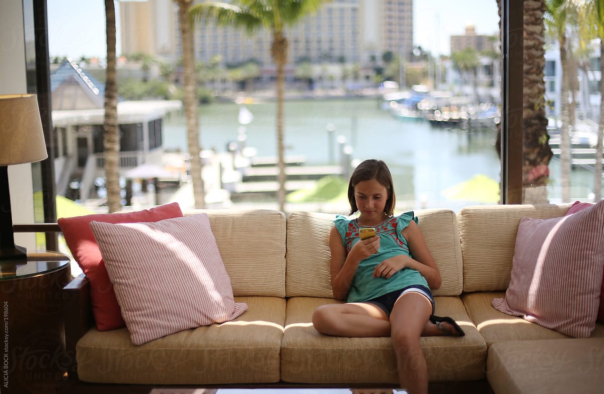 Tween Girl On Her Phone While On Vacation