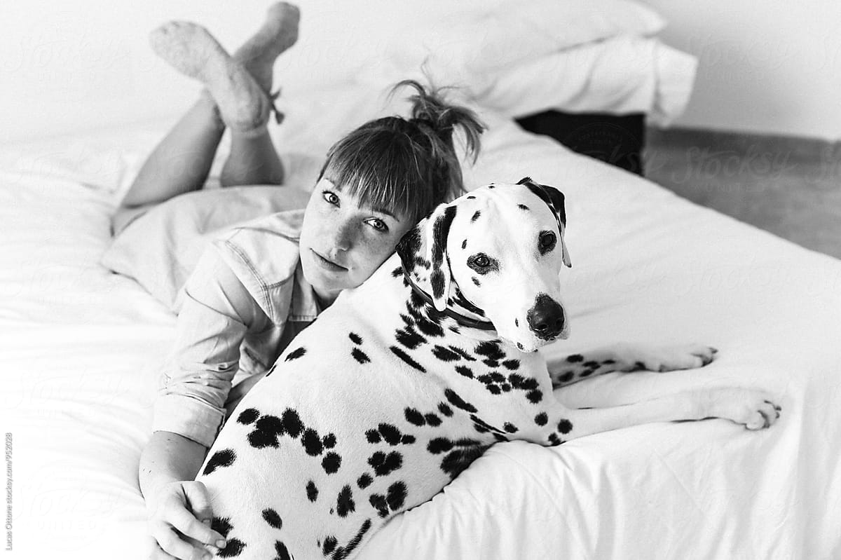Young woman with a dalmatian dog