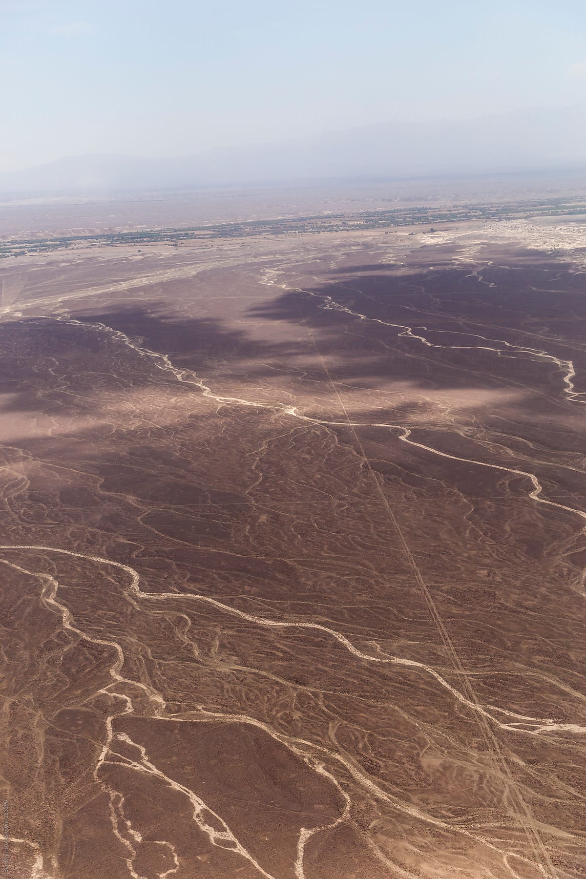 Dry river beds and Panamericana in Nazca Peru seen from air plane