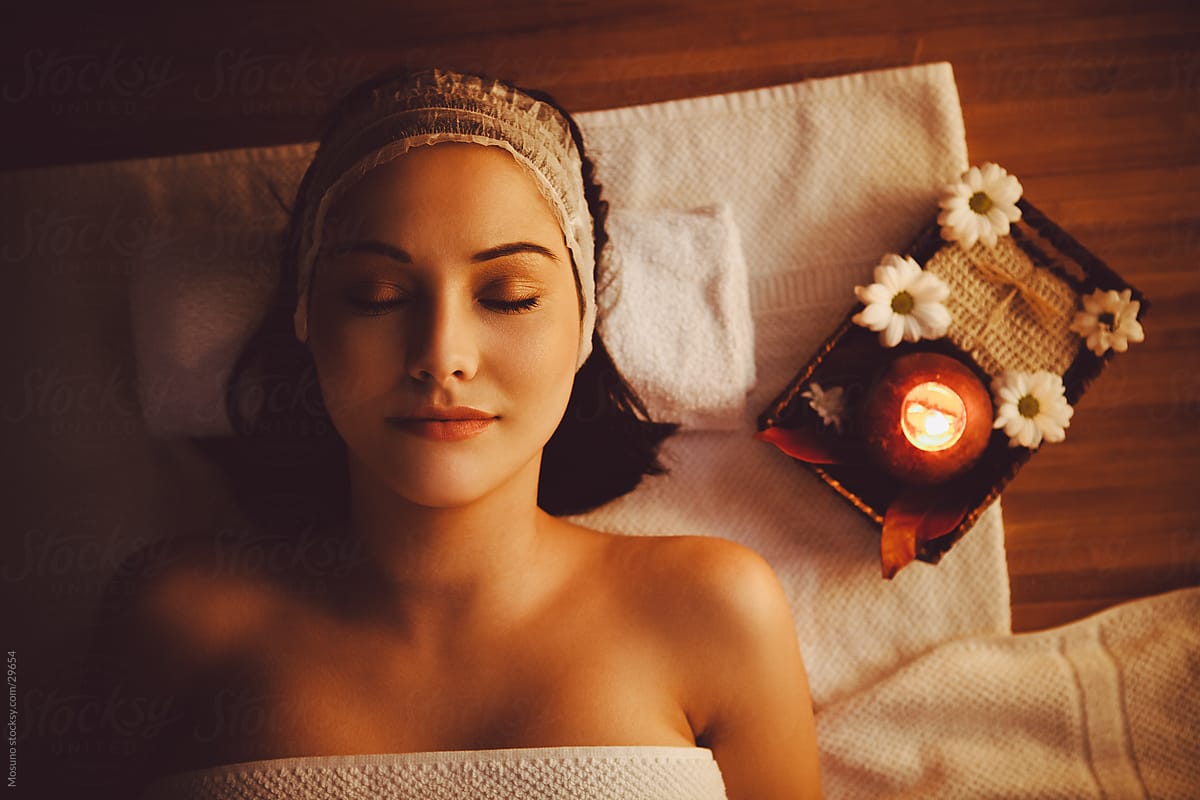 Woman Lying On A Massage Table In Spa Center Stock Image Everypixel