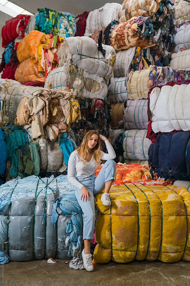 Pretty Woman in a Clothes Recycling Factory