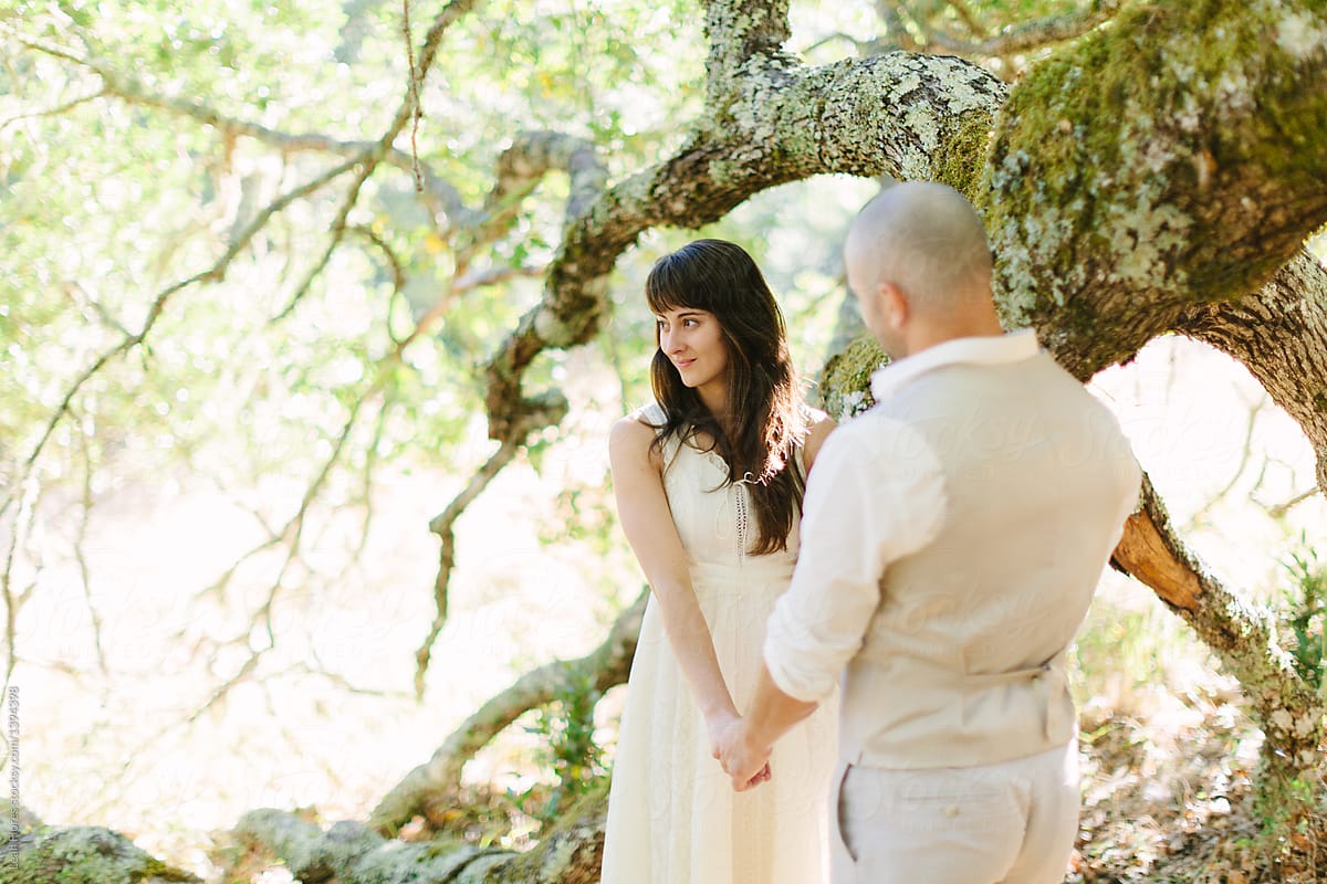 Wedding Couple in Forest by Large Branch